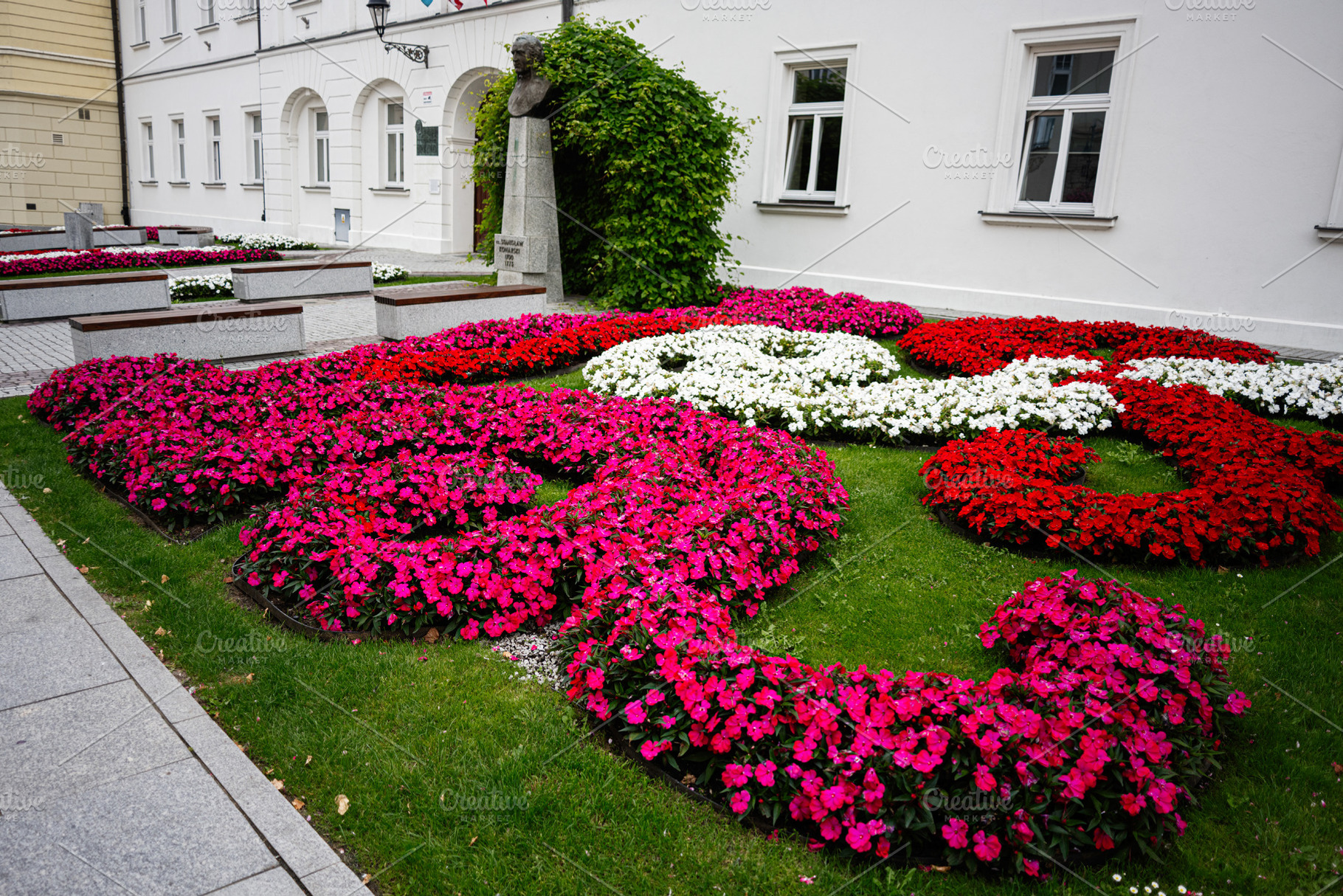 Colorful flower beds decorating a public garden in Rzeszow, Poland, a Photo by AS photostudio