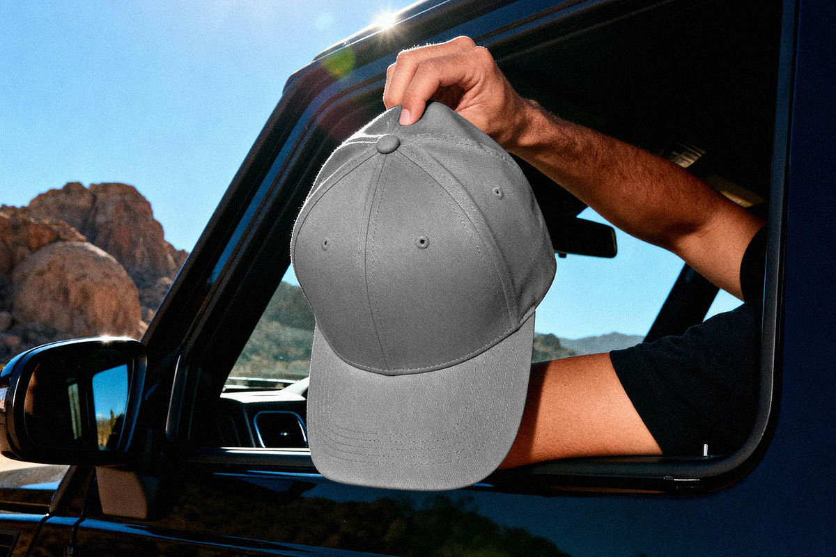 Baseball Cap Mockup in Desert Road, a Hat Mockup by Design Squad (Photo 2 of 4)