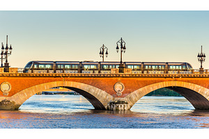 City tram on pont de pierre bridge in bordeaux france stock photo containing, an Architecture Photo by Leonid Andronov