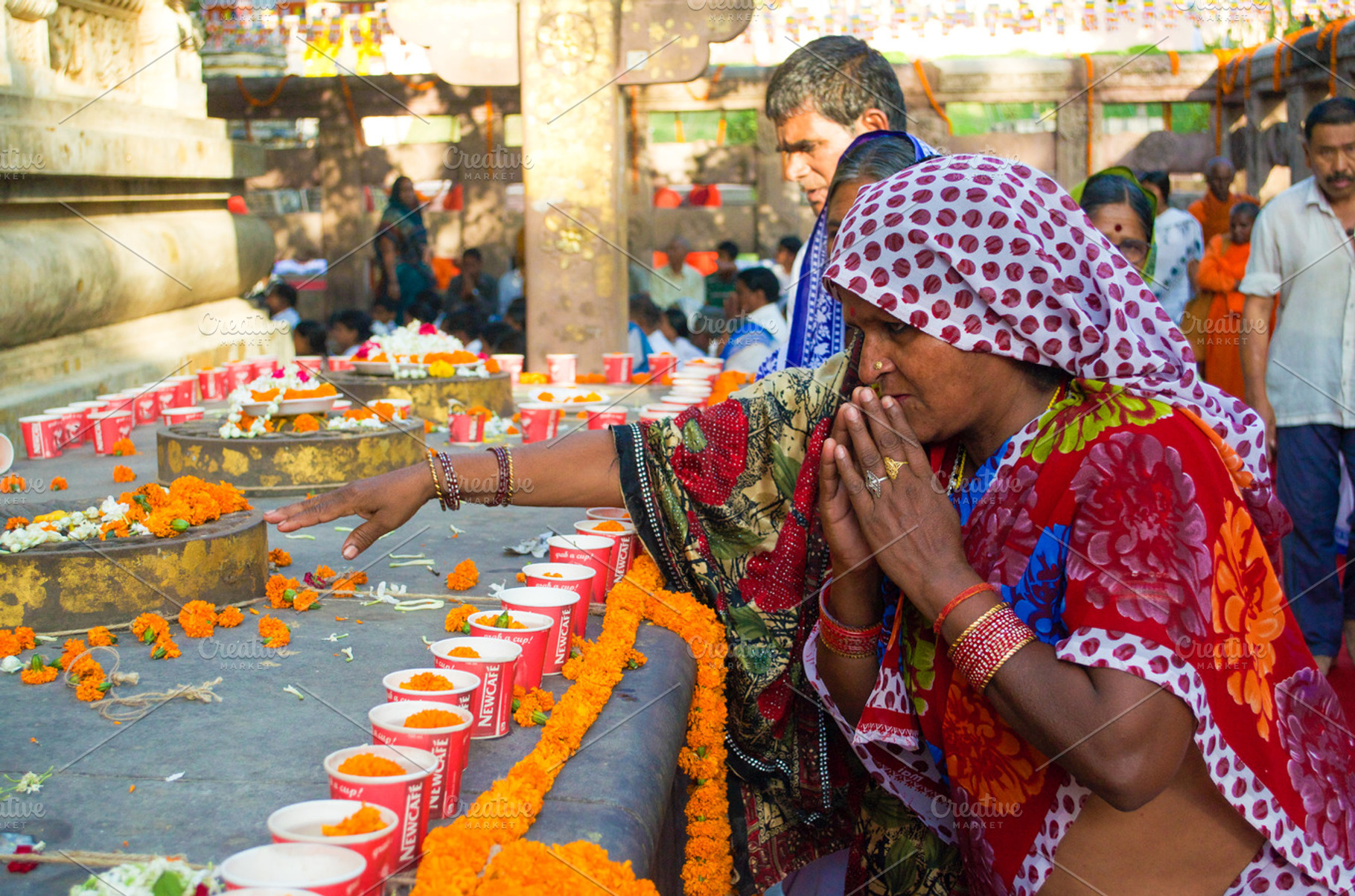 People pray for Buddha in India, a Person Photo by PeoGeo Studio