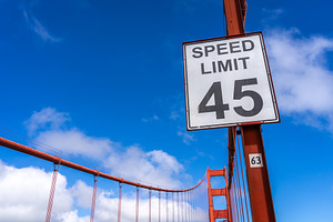 Golden Gate Bridge road view with red suspension cables, San Fra, an Architecture Photo by GoodGoods