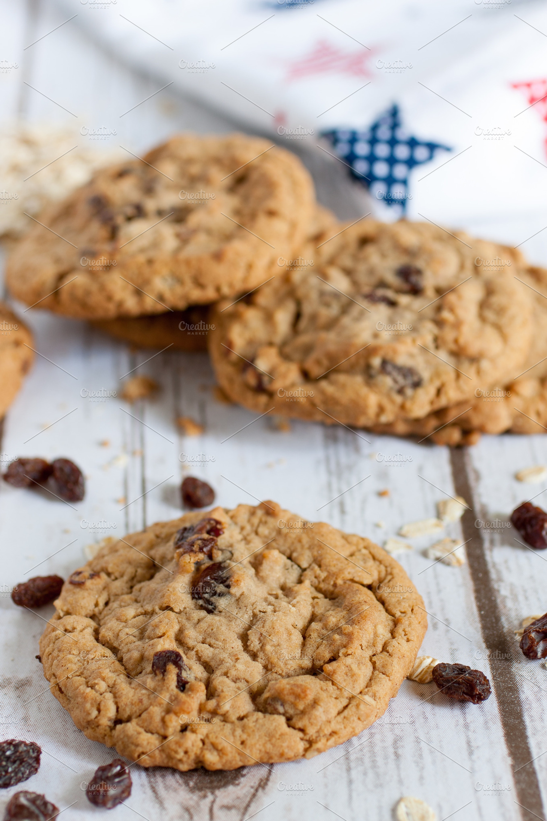 Fresh oatmeal raisin cookies featuring baked, board, and brown, a Food & Drink Photo by Southern Light