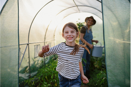 Portrait of happy little farmer girl, a Person Photo by HalfPoint