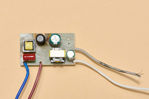 Electronic board with wires located on a beige background. Top v, a Technology Photo by ndanko