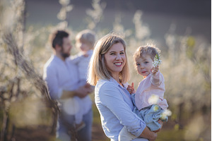 Spring portrait of parents with two, a Person Photo by HalfPoint