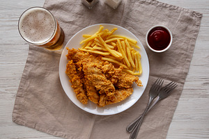 Homemade Chicken Strips with Fries on a Plate, top view. Flat la, a Food & Drink Photo by LiudmylaChuhunova