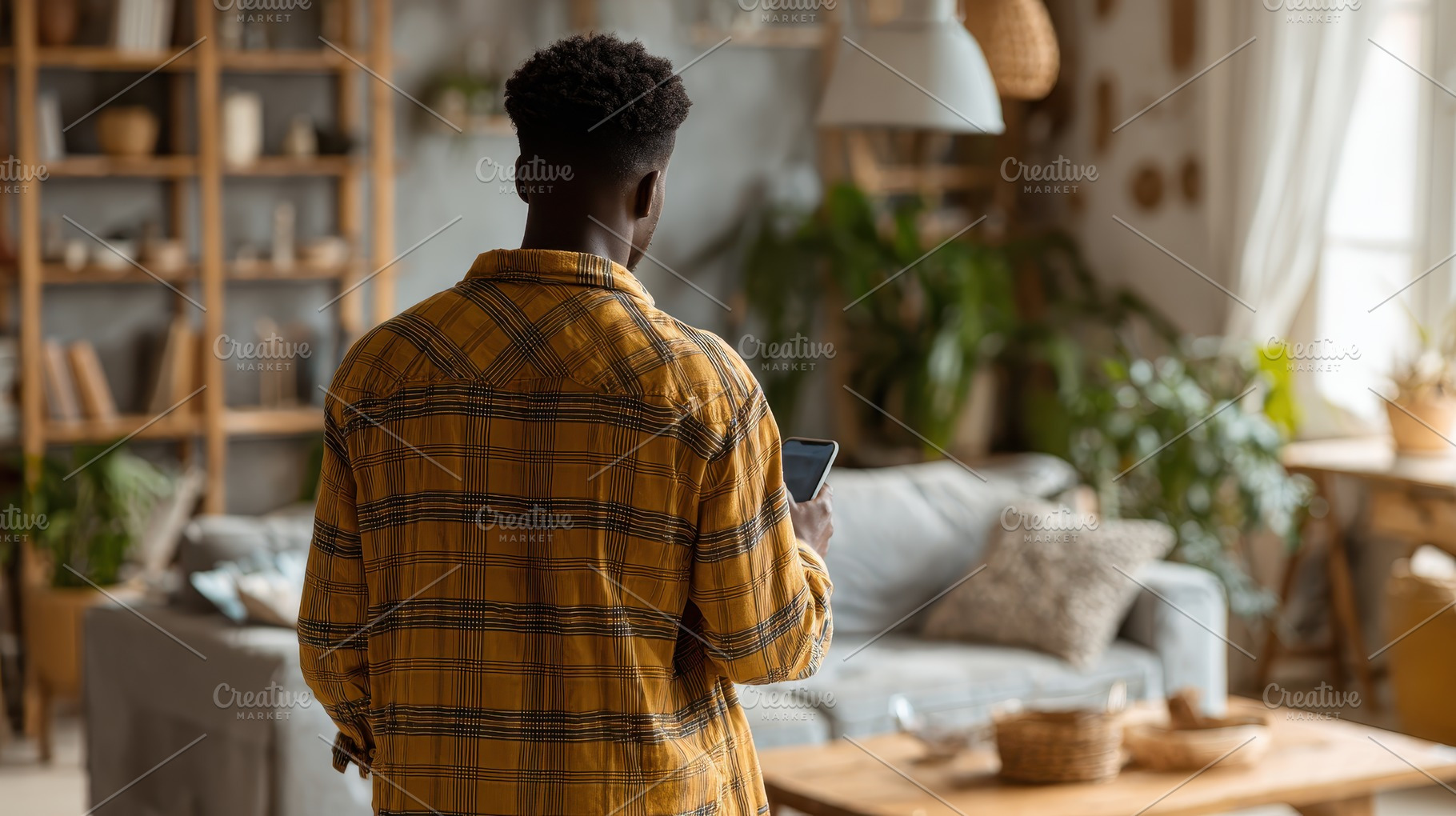 Man using smartphone in living room, a Photo by Pixeness Studio