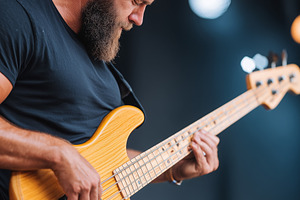 Bearded male bassist passionately, an Arts & Entertainment Photo by MistyDay