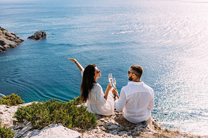 Honeymoon trip. Lovers on the beach