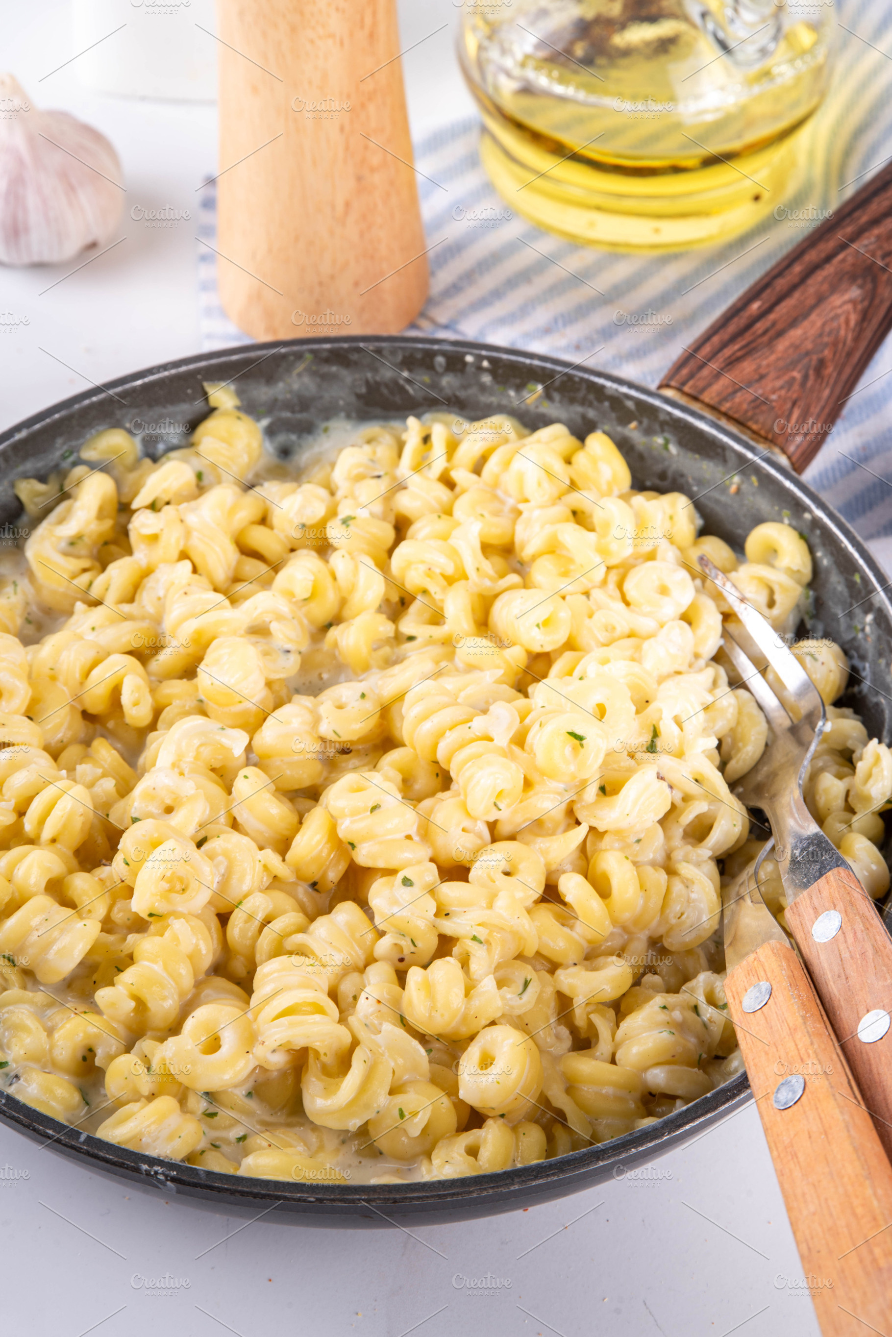 Fusilli bucati pasta with cheesy creamy sauce, a Food & Drink Photo by Rimma