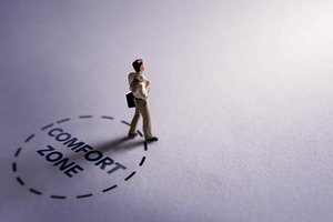 Businessman stepping out of comfort zone circle, personal growth, a Photo by salmon.black
