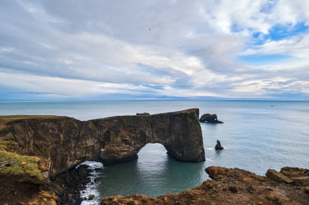 Picturesque autumn evening view to Dyrholaey coast cliffs and ro, a Photo by YuriyB