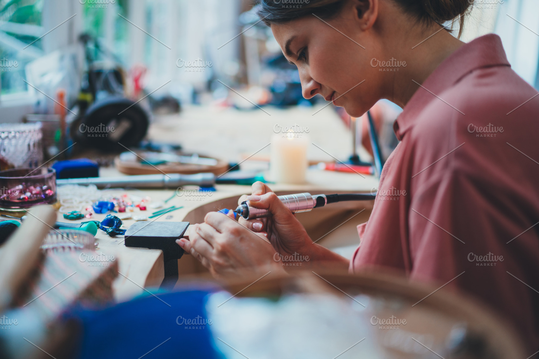 Jewelry maker works in studio, a Person Photo by ImYanis