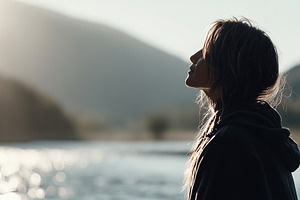 Peaceful woman enjoying sunrise, a Person Photo by MistyDay