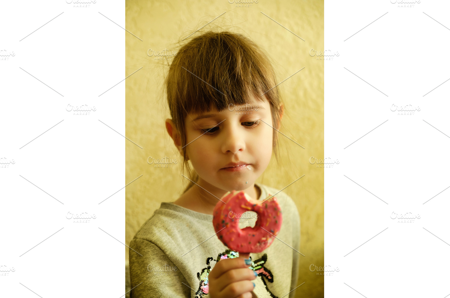 Little girl looking at a pink ice, a Person Photo by Rohan Photography