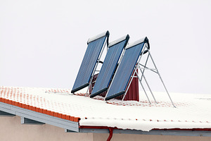 Roof in winter with solar panels, a Technology Photo by BOOCYS