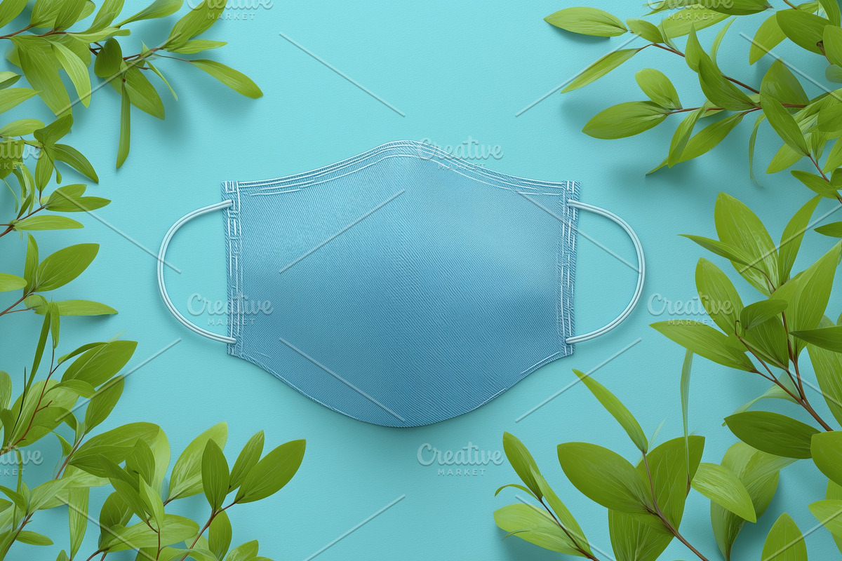 A blue face mask mockup placed on a light blue background surrounded by green l, a Mask Mockup by Textures & Backgrounds