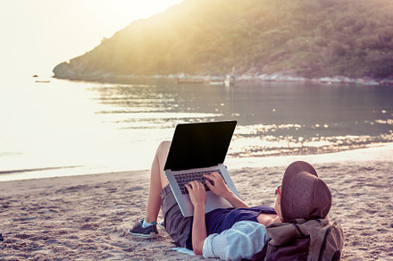 Freelancer stock photo containing laptop and beach, a Person Photo by Olezzo