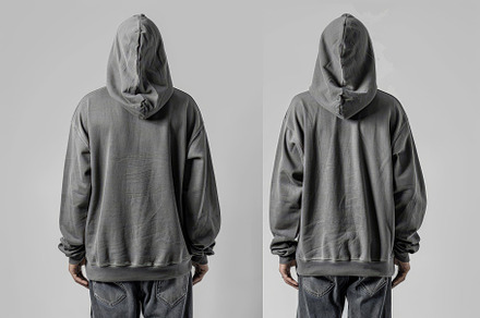 A person in a gray oversized hoodie, a Photo by Tanuart