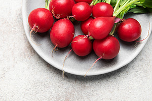 Fresh organic radish vegetables on plate for healthy eating, a Food & Drink Photo by Olena Rudo