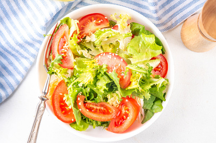 Vegetable salad with lettuce and sliced tomatoes, a Photo by Rimma