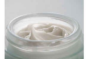Open glasss jar with cosmetic cream, a Beauty & Fashion Photo by Fascinadora