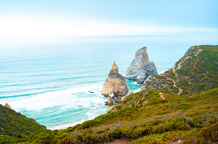 Praia Da Ursa Beach in summer day light, a Photo by andreonegin market