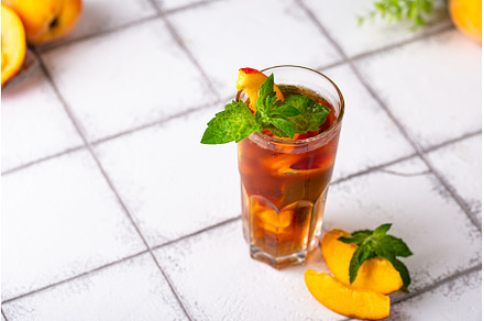 Cold ice tea with peach and mint, a Food & Drink Photo by Yulia Furman