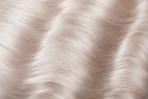 A closeup view of a bunch of shiny featuring hair, color, and salon