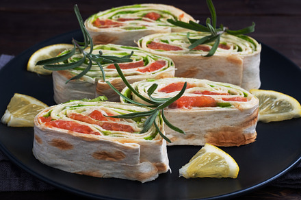 Rolls of pita bread and red salmon, a Food & Drink Photo by Elenglush
