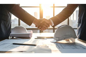 Two business professionals shaking, a Business Photo by Igor Tichonow
