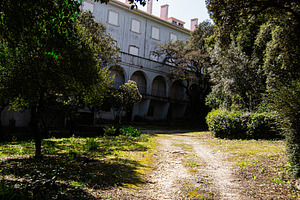 Serene building surrounded by lush greenery in Fatima, Portugal, under sunny sk, a Photo by AS photostudio