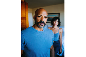 Couple in bedroom sharing a moment, a Person Photo by Lermont51