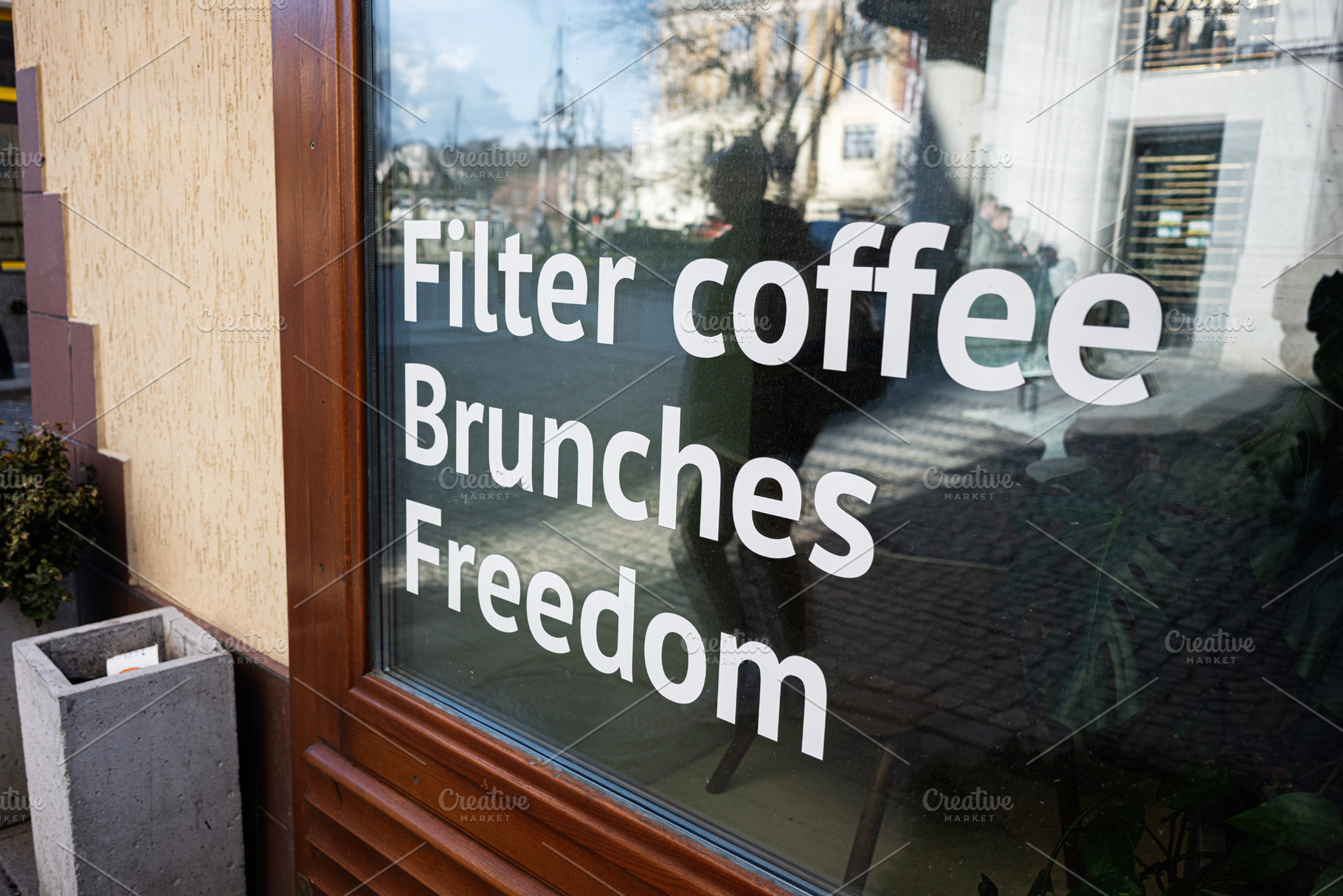 Filter coffee, brunches, freedom. Cafe window with filter coffee sign reflectin, a Photo by AS photostudio