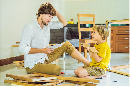 Father and son assembling furniture, an Architecture Photo by Elizaveta Galitskaya