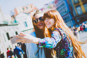 Two smiling tourists taking selfie in Genoa, Italy, a Person Photo by Antonio Gravante Market