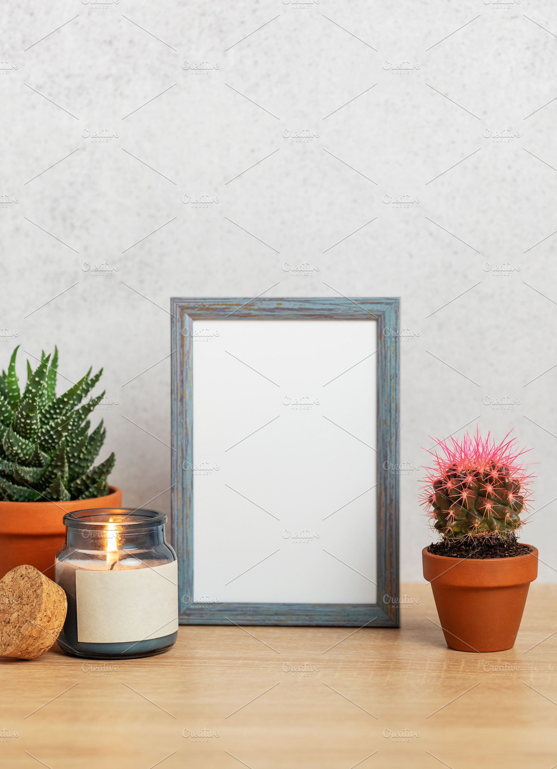 Empty frame, burning candle and succulents creating cozy home at, a Nature Photo by Olena Rudo
