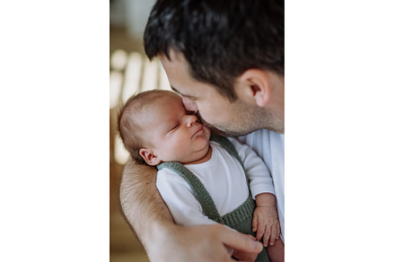 Close-up of father kissing his, a Person Photo by HalfPoint