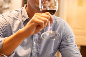 Man enjoying a glass of red wine during restaurant dinner, a Person Photo by etorres69