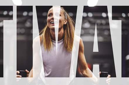 Smiling women working out together in a gym