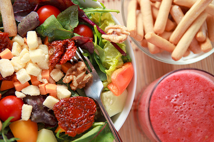 Healthy food containing salad, cheese, and tomatos