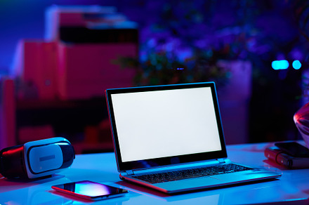modern office with table, tablet PC and laptop blank screen, a Technology Photo by Alliance Images