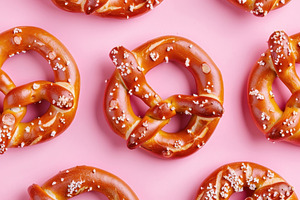 Multiple salted pretzels neatly arra, a Photo by LOGOCREATIVE