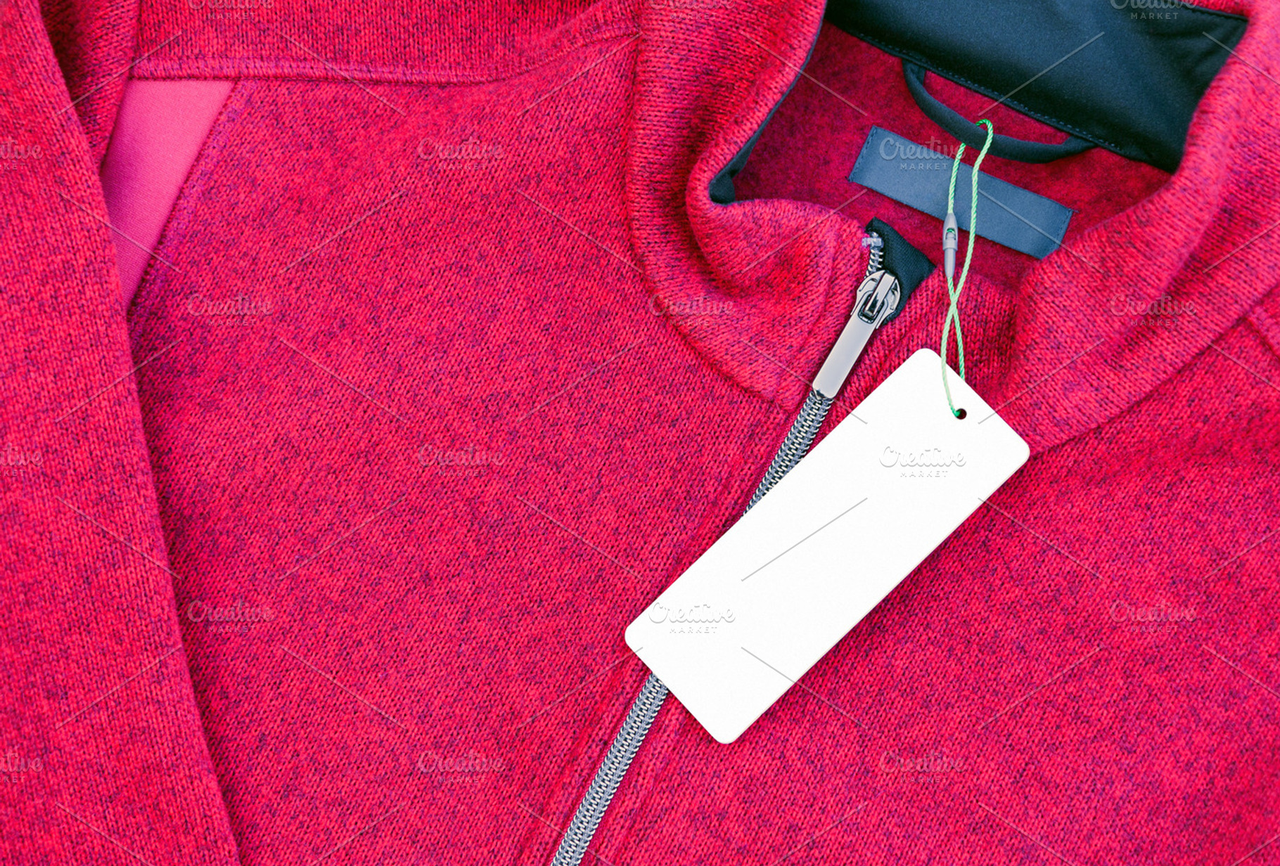 Clothing label tag on a red jacket, a Business Photo by BOOCYS