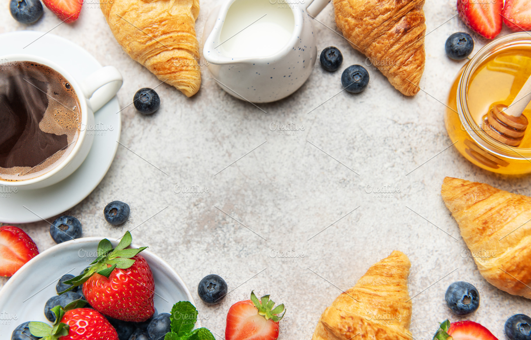 Continental breakfast composition with croissants, coffee, berri, a Food & Drink Photo by Olena Rudo