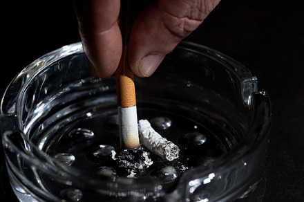 Ashtray and smoking cigarette on bla, a Health & Medical Photo by AlexBush
