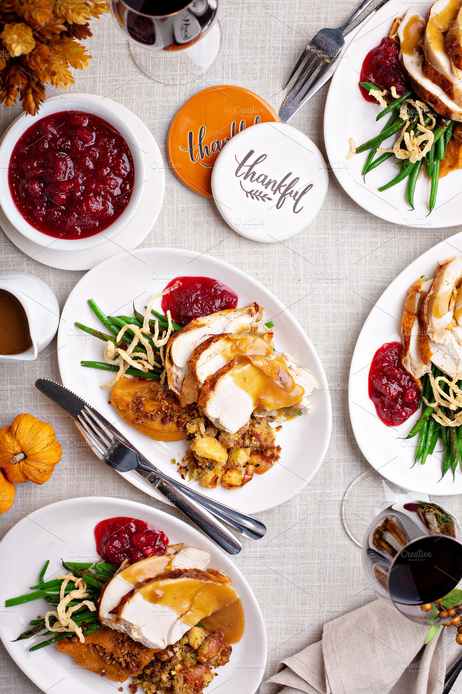 Traditional Thanksgiving plates with turkey and sides, a Food & Drink Photo by farwasser