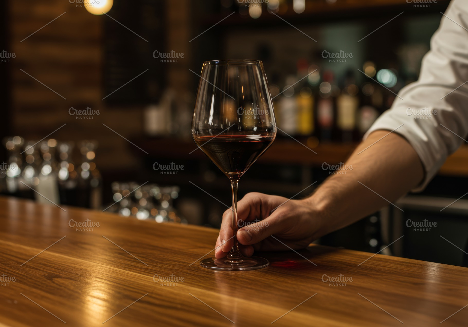 Hand serving a glass of red wine on, a Food & Drink Photo by professorinc
