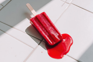 Melted popsicle on tiled floor, a Food & Drink Photo by Virgo Studio