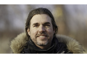 Portrait of smiling man with long, a Person Photo by Media Whale Stock
